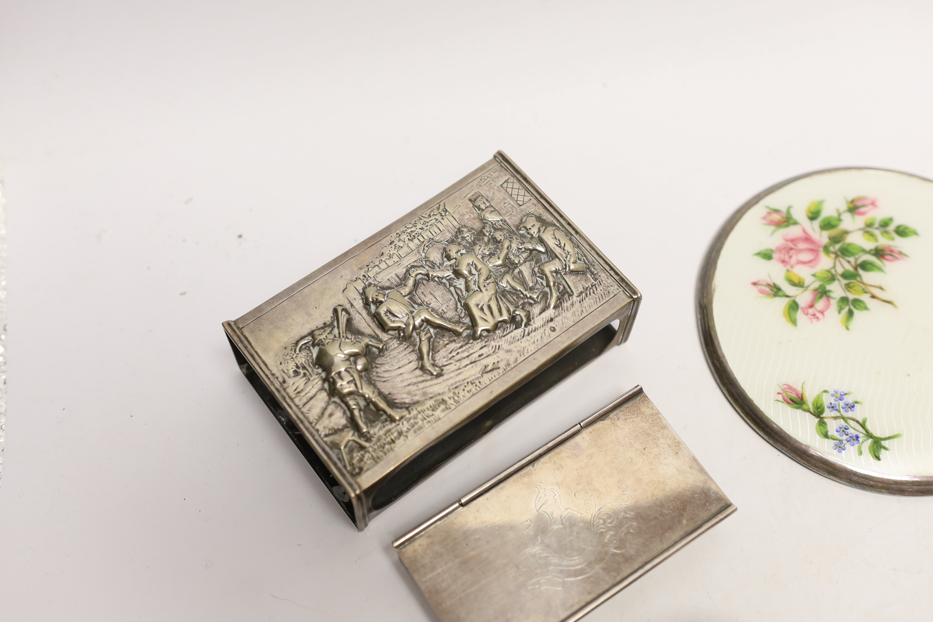 A group of assorted silver and white metal items including a George V trinket box, cigarette case, sterling stamp box, Dutch matchbox holder, George V sugar basket by William Comyns (no liner), two toddy ladles and two o